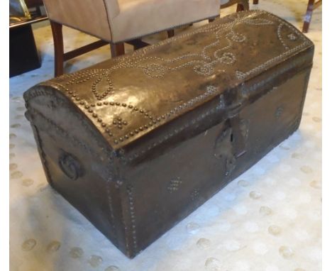 DOMED TRUNK, 18th century, Portuguese, leather and studded with hinged top, 90cm L x 46cm H x 46cm D.