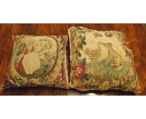 CUSHIONS, two, made from 18th century Aubusson tapestry, each approx. 40cm x 40cm. (2)