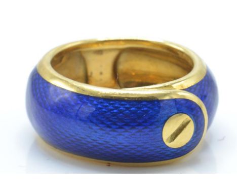 A French&nbsp;18c&nbsp; gold and enamel ring by Van Cleef and Arpels, circa 1968. the 18ct gold stylised belt ring applied wi