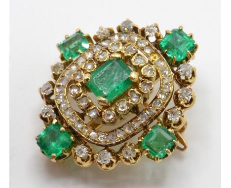 A French 18ct gold, emerald and diamond brooch pin. The brooch set with a central emerald surrounded by rose and old cut diam