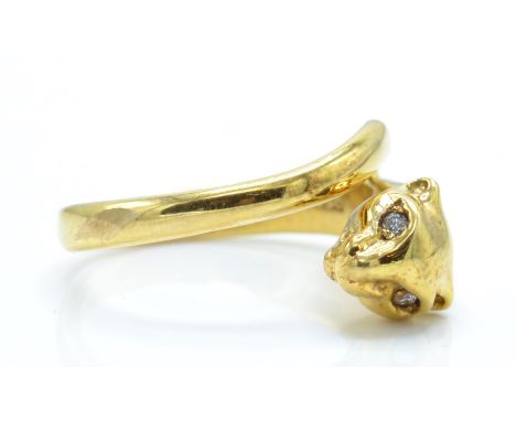 An 18ct gold and diamond figural ring. The ring in the form of a panther having diamond set eyes. Marked 750. Total weight 9.