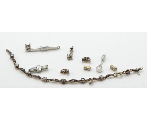 A collection of diamond findings to include mixed cut, baguette, old cut, pear and rose cut stones being set within, silver w