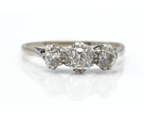 An 18ct white and platinum 3 stone ring. The ring set with graduating old cut diamonds. Estimated diamond weight 0.80cts. Tot