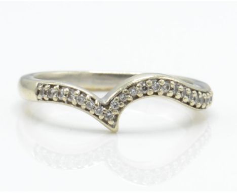 A hallmarked 9ct white gold and diamond wishbone ring. The ring having 22 illusion set round brilliant cut diamonds. Hallmark