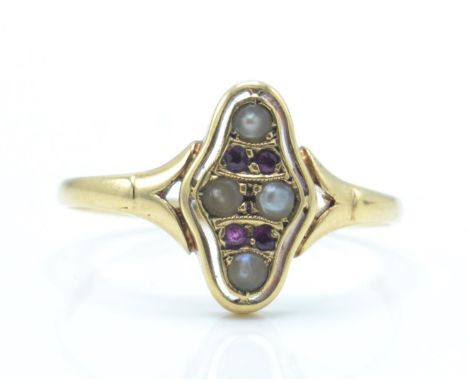 An antique 14ct gold ruby and pearl ring. The ring being set with ruby and half pearls within a pierced lozenge setting. Mark