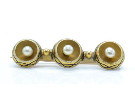 A Victorian 19th century 9ct gold&nbsp; pearl and enamel bar brooch pin. The brooch formed of 3 roundels set with pearls with