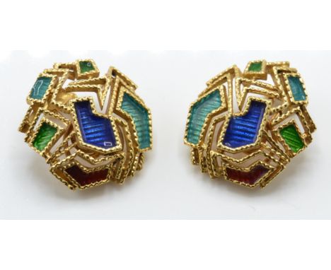 A pair of 18ct gold and enamel ear clips. The earrings having applied enamel decoration within geometric filigree work comple