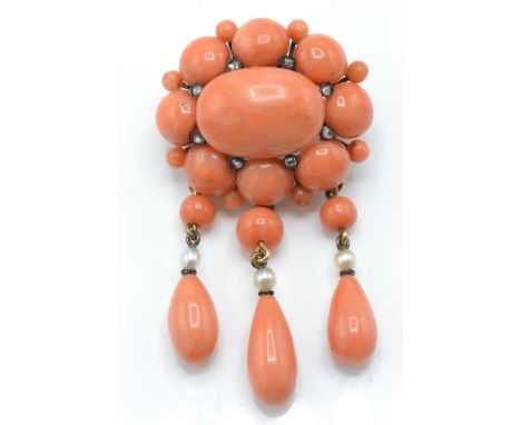 An 18ct gold and precious coral, pearl and diamond brooch pin. The brooch pin having 3 coral and pearl drops with black ename