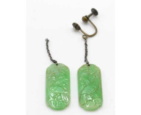 A pair of early 20th century Chinese Jade drop earrings. Each piece of jade of lozenge form having chase decorated birds deco