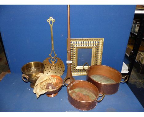 A box of mixed copper and brass to include; copper horn, rose bowl, a heavy brass photo frame, copper cooking pots, etc.