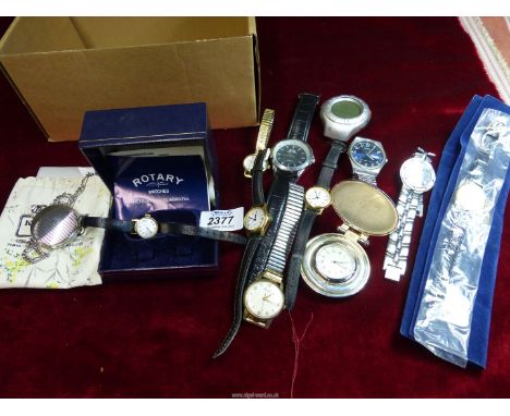 A quantity of watches including Toyota lady's wristwatch in pouch, Fossil VT-2594 fob watch, Swiss made continental wristwatc