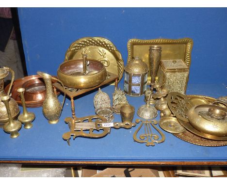 A large quantity of copper and brass to include vases, trivet, tea caddy, etc.