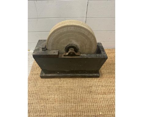 A vintage wet grinding stone grinder 