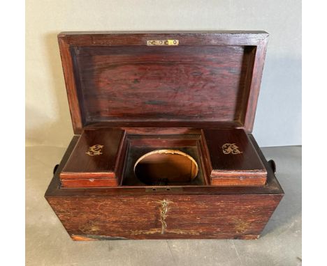A mahogany tea caddy with mother of pearl inlay and turned handles 
