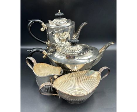 A Four Piece silver tea service to include teapot, hot water jug, sugar bowl and milk jug by A Marston & Co hallmarked for Bi