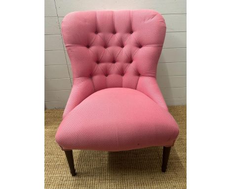 A pink upholstered button back salon chair on turned mahogany legs 