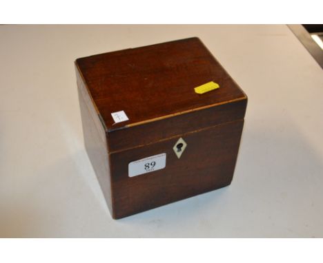 A George III mahogany and boxwood edged tea caddy with ivory key plate