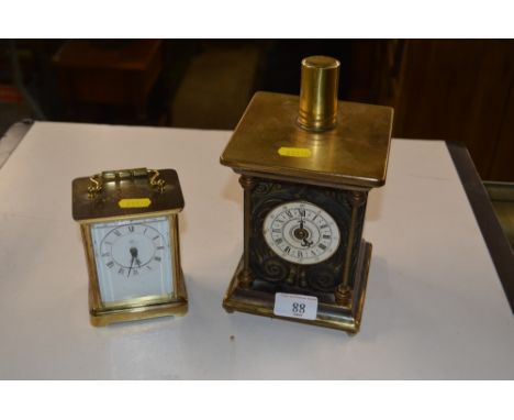 A brass cased mantel clock with quartz movement; and a musical mantel clock