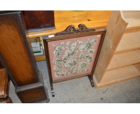 A mahogany and needlework firescreen 