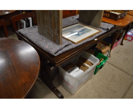 A dark Ercol draw leaf table 