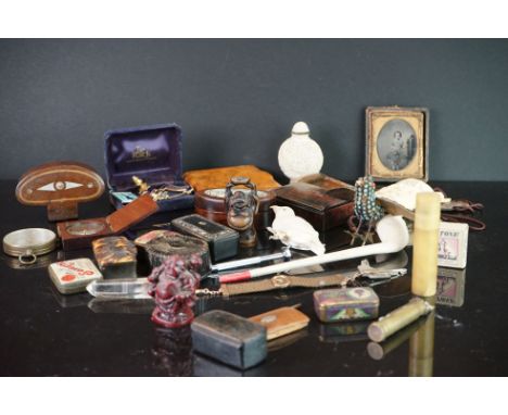 A box of mixed collectables to include treen boxes, badges, trench lighter, snuff boxes .. etc.. 
