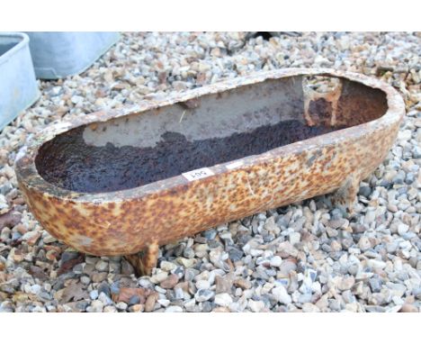 An early 20th century cast iron feeding trough. 