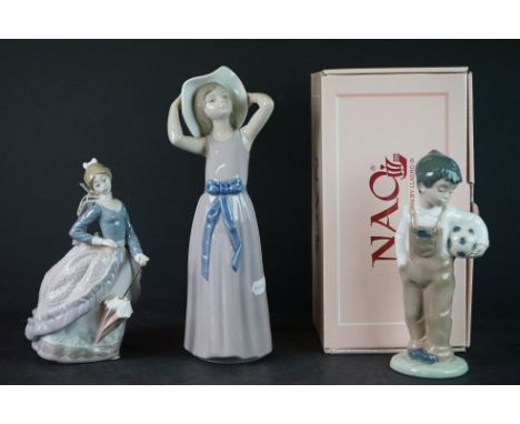 Two Lladro Figurines including Girl holding Bonnet and Lady holding Parasol together with a Boxed Nao Boy holding Ball 01068 