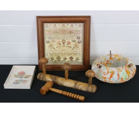 A box of mixed collectables to include a wooden gavel, an Art Deco glass lamp shade and framed sampler. 