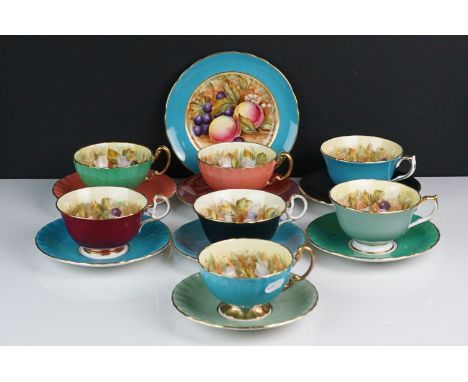 Seven Aynsley Tea Cups and Saucers with fruits decoration plus a matching tea plate 