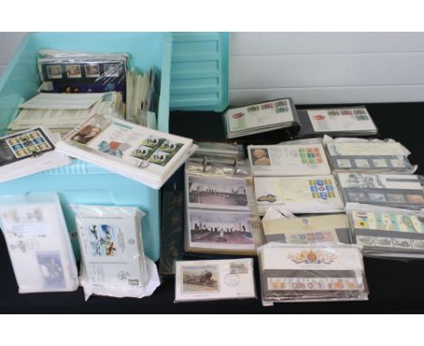 A large collection of mainly Royal Mail first day covers within albums and loose examples. 