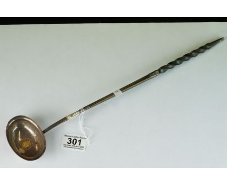 A silver toddy ladle with inset coin dated 1802, 