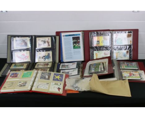 A collection of mixed stamps, first day covers and Royal Mail stamp postcards contained within albums 