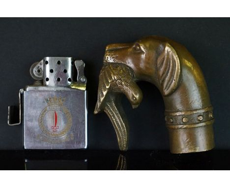 A Zippo light with the City Of London Corporation coat of arms together with a brass walking stick handle in the form of a hu