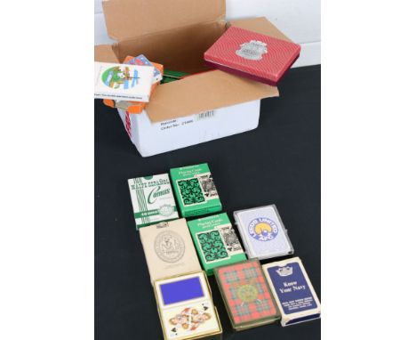 A small collection of boxed playing cards. 