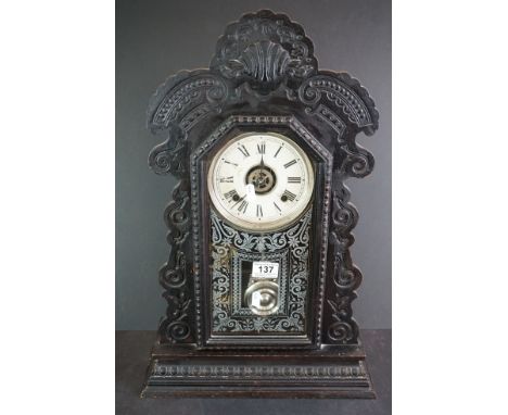 A vintage American Ansonia gingerbread wooden mantle clock. 