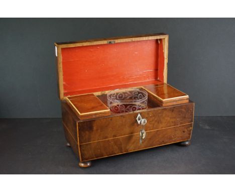 A 19th century sarcophagus tea caddy with fitted interior to include mixing bowl and key. 