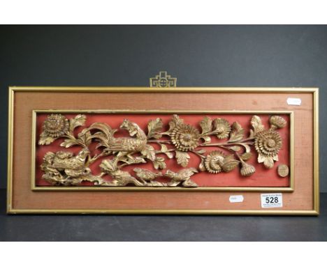 Oriental Giltwood Pierced Carved Panel depicting Birds within Foliage, 45cm x 13cm, mounted on a panel and framed 