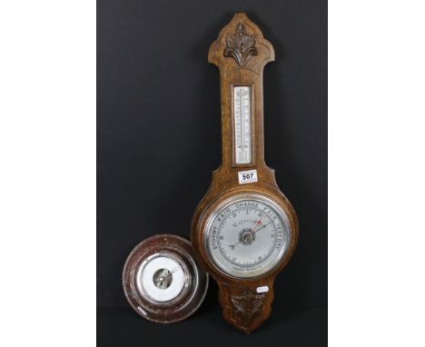 A oak wall hanging Aneroid barometer with mercury thermometer together with another barometer. 