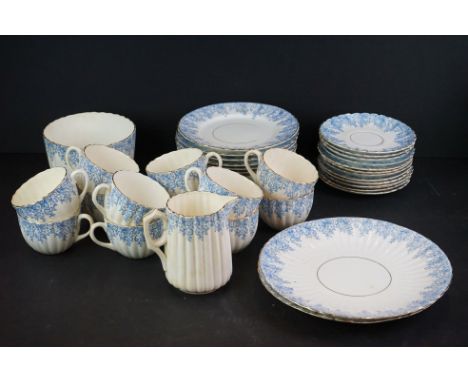 Early 20th century Part Tea Service decorated with blue flowers, makers marks to base, comprising 12 tea cups, 12 saucers, 11
