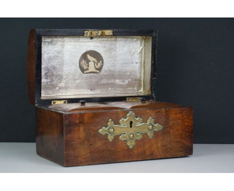 A wooden tea caddy in the form of a chest with brass pierced decoration. 