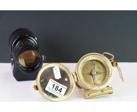 A Brass compass together with a Spylux monocular. 