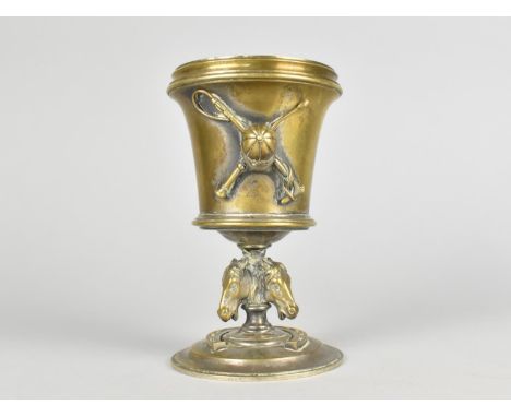 Of Horse Racing Interest, A Novelty Desktop Brass Match or Spill Holder Of Vase Form, Decorated with Jockey Cap, Whip and Cro