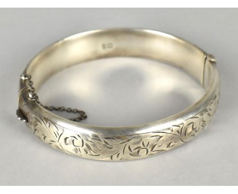 A Silver Bangle by J.S Chester 1958 with Floral Border and Safety Chain