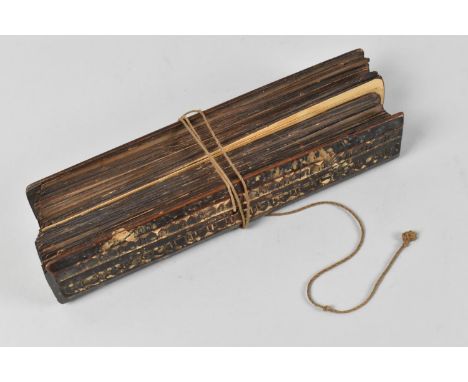 A 19th Century Palm Leaf Manuscript Containing Approx 100 Leaves, Most with Double Sided Text and Having Chip Carved Wooden E