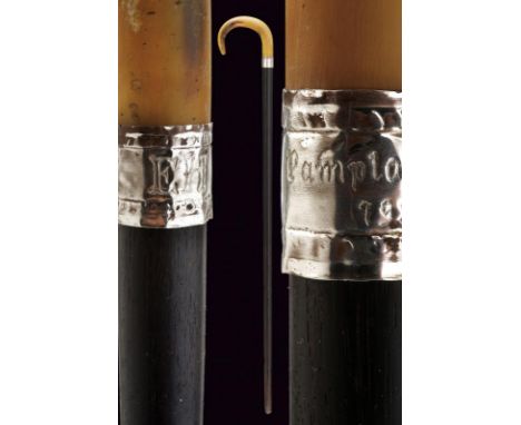 dating: first quarter of the 20th Century provenance: Spain, Curved handle made of dark horn. Silver-foiled ring nut featurin