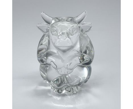 A clear glass figurine showcasing a bull, symbolizing strength and perseverance as a powerful optimist. Inspired by historica