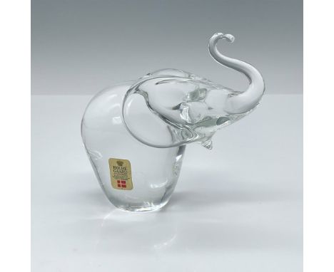 Crystal paperweight depicting an elephant with its trunk elegantly raised skyward. Holme Gaard sticker and artist initials to