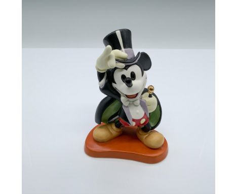 Mickey Mouse dazzles in his vintage magician's tuxedo, complete with a flowing cape and top hat, confidently wielding his mag