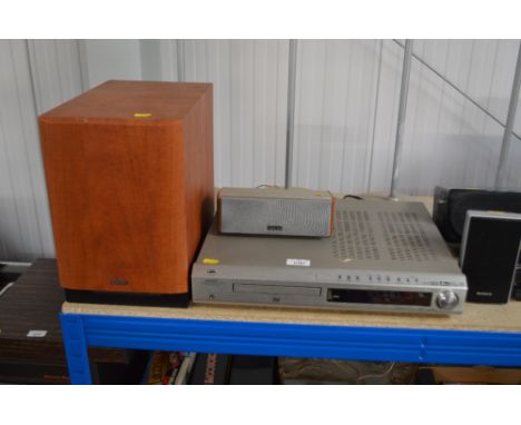 A Denon surround sound with floor standing speakers, sub woofer and one other speaker