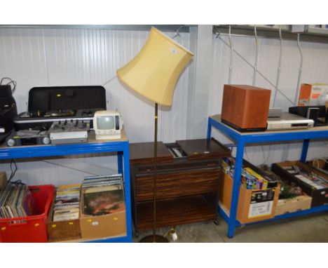 A brass standard lamp and shade